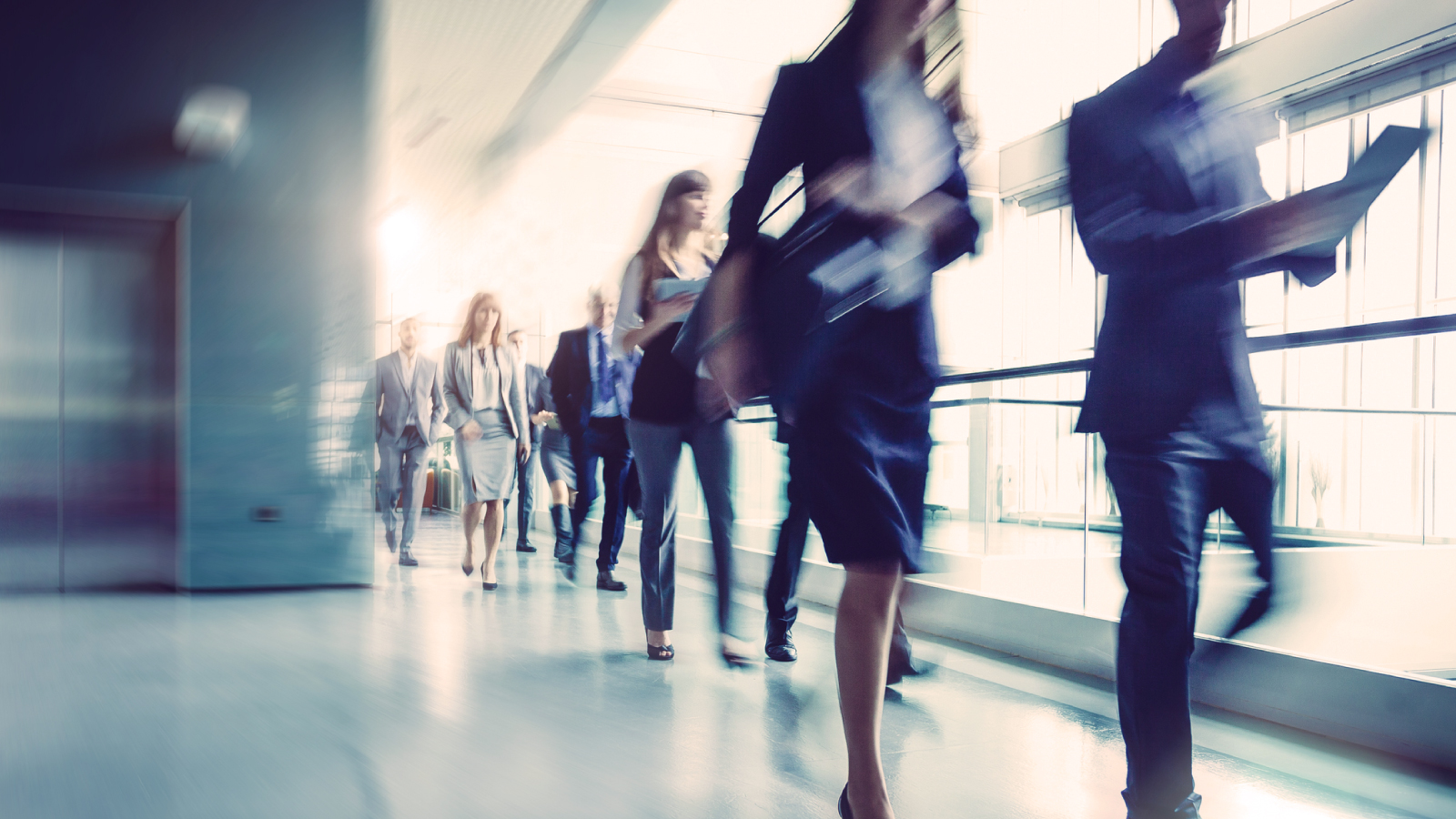 Anaplan ebook on strategic workforce blueprinting. The text highlights real-world guidance on workforce planning transformation, with an image of business professionals walking in a modern office setting.