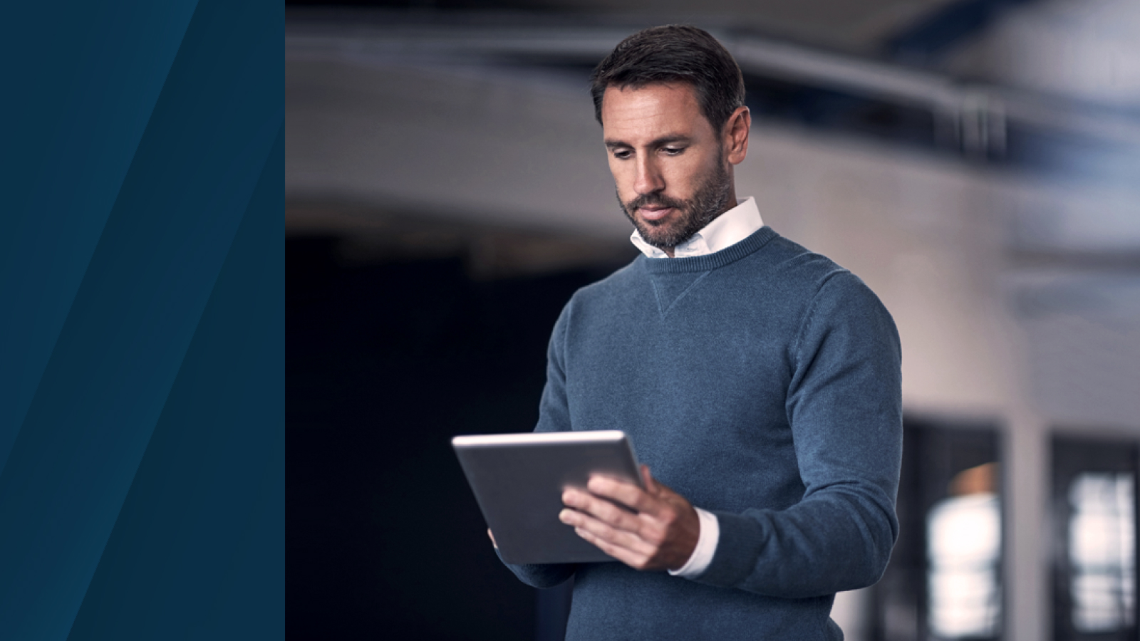  Anaplan datasheet on integrated financial planning. The text highlights next-gen financial planning that delivers connected finance, with an image of a man using a tablet in a modern office, set against a dark ink background.